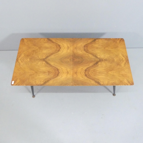 2083 - A mid-century walnut veneered plywood coffee table, raised on ebonised dansette legs. 90x40x45cm.