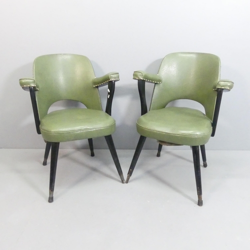 2087 - A pair of mid-century style faux-leather upholstered arm chairs on ebonised frame.