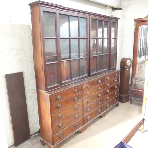 2122 - A large and impressive antique mahogany two-section shop display cabinet, the upper section having t... 