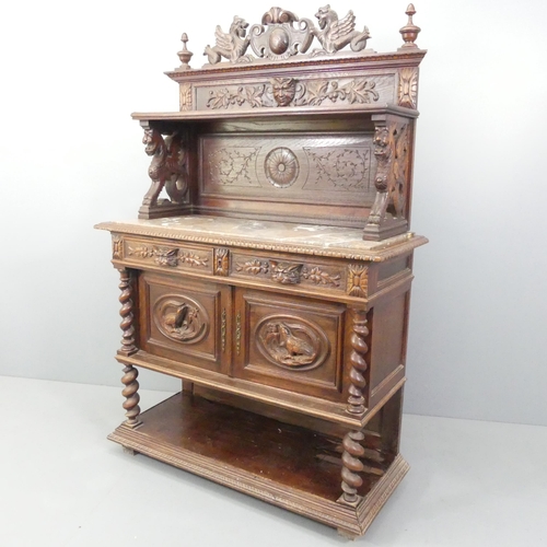 2124 - A French carved oak buffet, with marble top, raised back, two drawers above two cupboard doors, deco... 