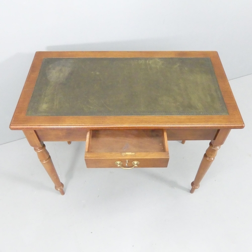 2142 - A Victorian mahogany writing table, with tooled and embossed green leather skiver, single drawer and... 