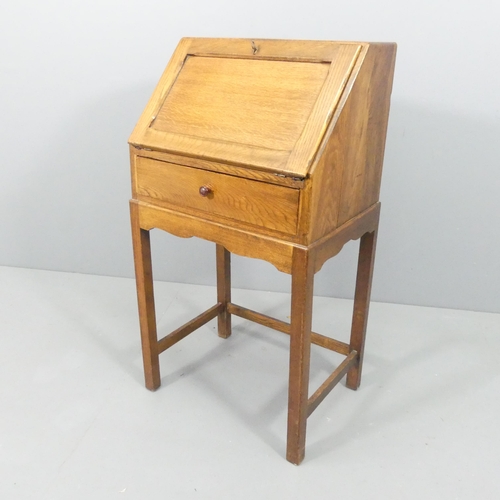 2158 - An early 20th century light oak bureau on stand, the fall-front revealing a fitted interior. 54x101x... 