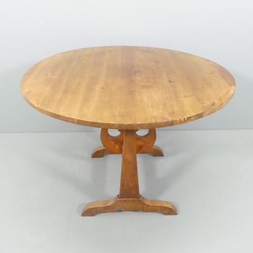 2168 - A French yew-wood tilt-top wine tasting table, on oak base with lyre decoration. 104x77cm.