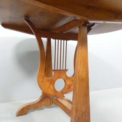 2168 - A French yew-wood tilt-top wine tasting table, on oak base with lyre decoration. 104x77cm.