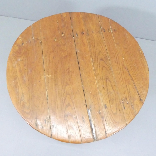 2169 - A French oak tilt-top wine table. 81x66cm.