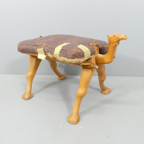 2176 - A vintage hardwood camel saddle stool. Cushion A/F. 80x50x45cm.