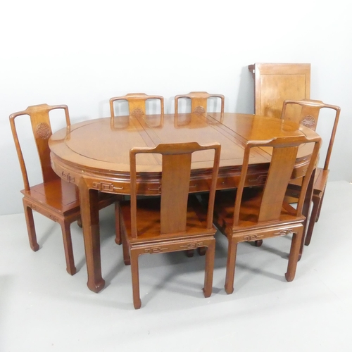 2182 - A modern Chinese teak draw-leaf extending dining table, 163 (extending to 213cm)x77x114cm, and six m... 