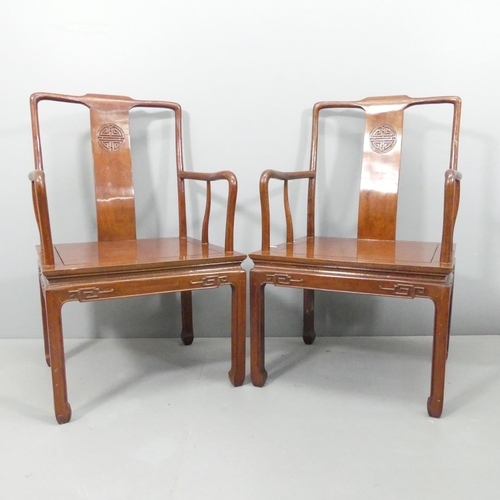 2183 - A pair of modern hardwood Chinese open armchairs, with applied carved decoration.