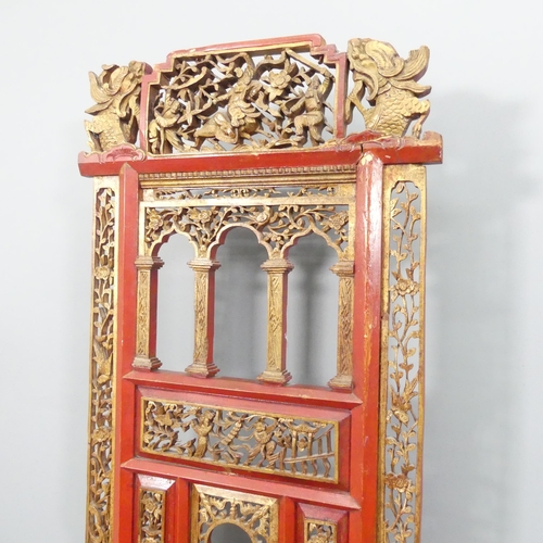 2187 - A Chinese red-lacquered and gilded wash stand, with two drawers, folding front and carved and pierce... 