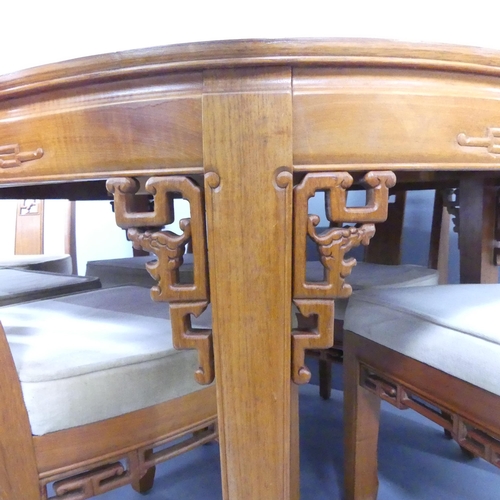 2192 - A modern Chinese hardwood draw-leaf extending dining table with two spare leaves, 167x78x112cm, and ... 