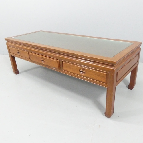 2193 - A modern Chinese hardwood coffee table, with inset glass panelled top and three frieze drawers. 127x... 