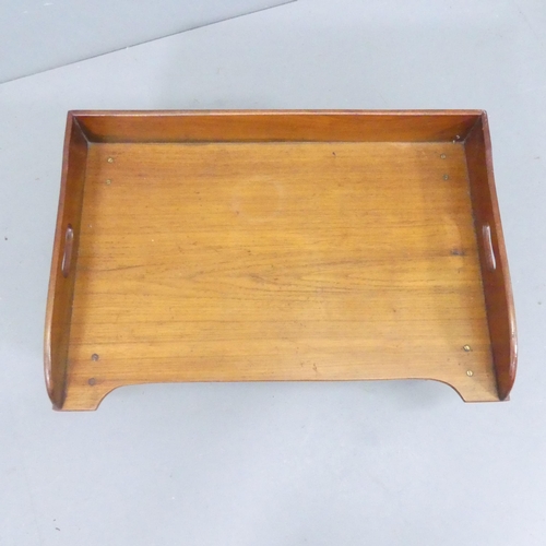 2196 - An antique mahogany bed tray table, raised on turned legs. 61x28x41cm.