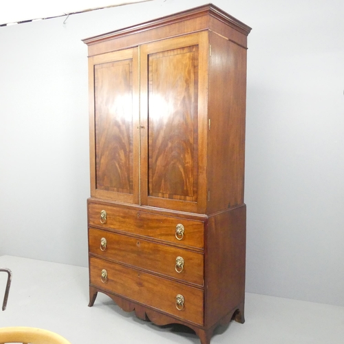 2197 - A 19th century mahogany and ebony-strung two-section linen press, the top section with two panelled ... 