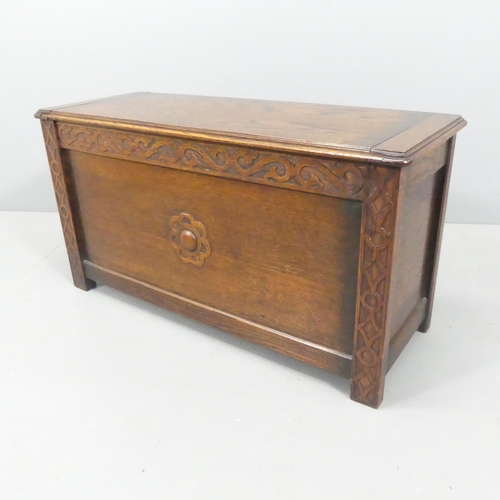 2211 - A panelled oak blanket box, with applied carved decoration. 91x48x35cm.