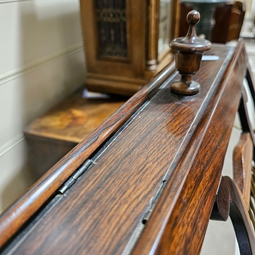 117 - A 19th century rosewood duet music stand, with brass candle brackets, adjustable column and platform... 