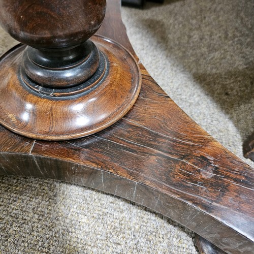 117 - A 19th century rosewood duet music stand, with brass candle brackets, adjustable column and platform... 