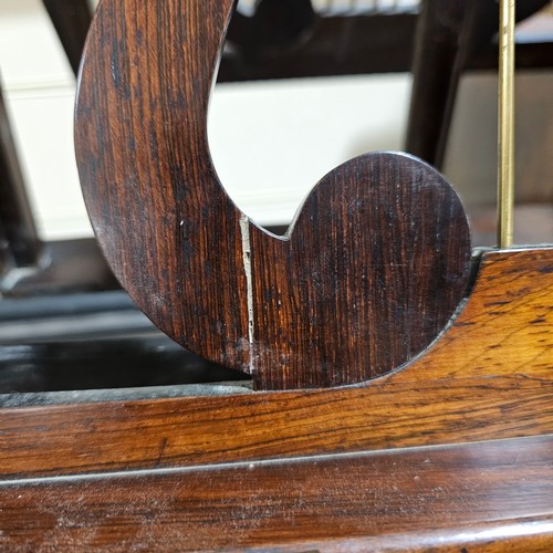 117 - A 19th century rosewood duet music stand, with brass candle brackets, adjustable column and platform... 