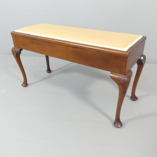 2230 - A 19th century mahogany and upholstered duet stool, with lifting seat, cabriole legs and applied car... 