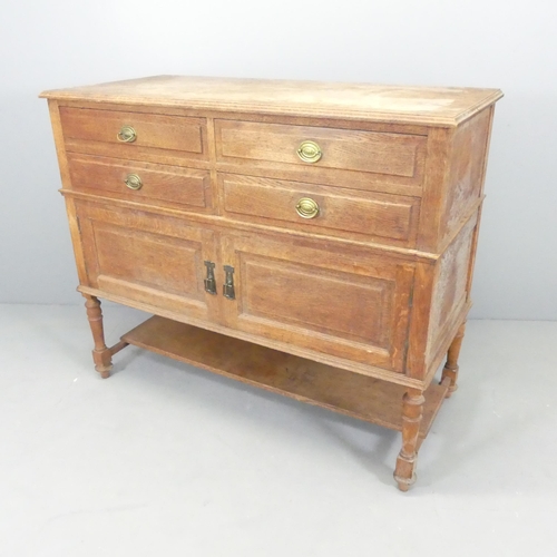 2511 - An early 20th century two-section oak sideboard, with four drawers above two cupboards with shelf un... 