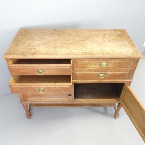 2511 - An early 20th century two-section oak sideboard, with four drawers above two cupboards with shelf un... 