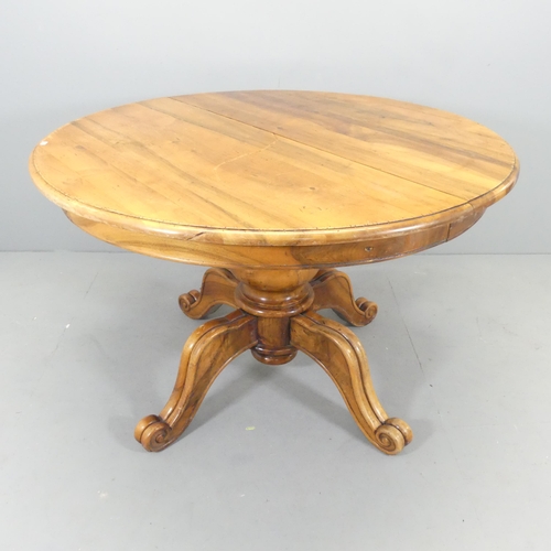 2535 - A French mahogany circular topped dining table, on turned central column with quadruple leg base. 12... 