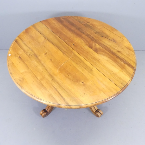 2535 - A French mahogany circular topped dining table, on turned central column with quadruple leg base. 12... 