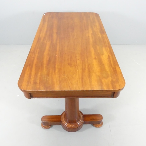 2553 - A Victorian mahogany writing table. 133x72x70cm.