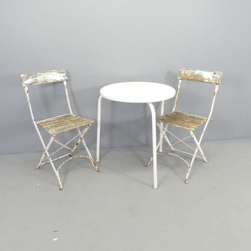 2612 - A pair of Parisienne style folding cafe chairs, and a circular garden table, 68x70cm.