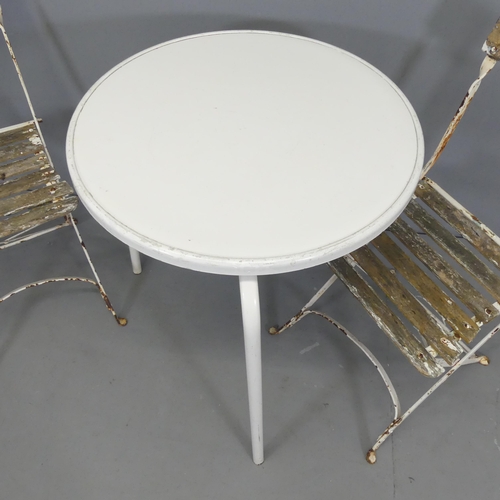 2612 - A pair of Parisienne style folding cafe chairs, and a circular garden table, 68x70cm.