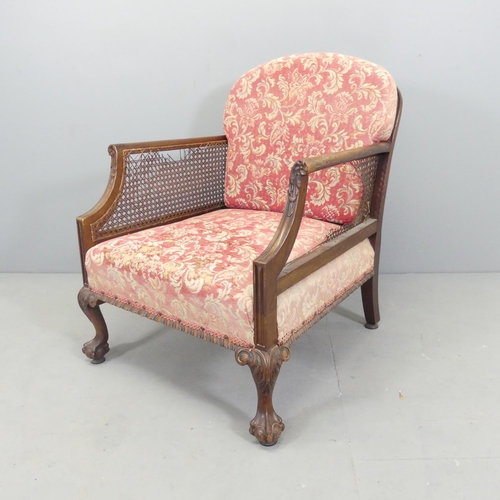 2664 - A 19th century mahogany bergere lounge chair, with label to underside for S. & H. Jewell, London. Ca... 