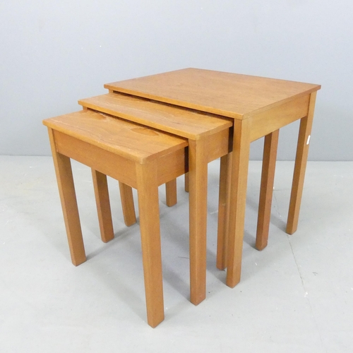 2665 - HERBERT E. GIBBS - a mid-century nest of three teak occasional tables. Largest 46x46x36cm.