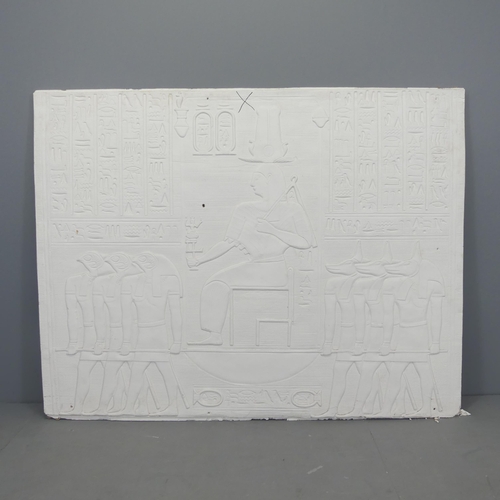 2670 - A plaster panel with moulded Egyptian hieroglyph decoration. 151x118x3cm.