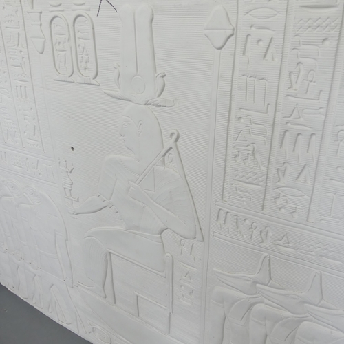 2670 - A plaster panel with moulded Egyptian hieroglyph decoration. 151x118x3cm.