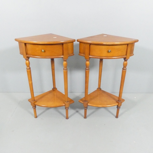 2686 - A modern pair of yew wood two-tier corner tables, each with single drawer and raised on turned suppo... 