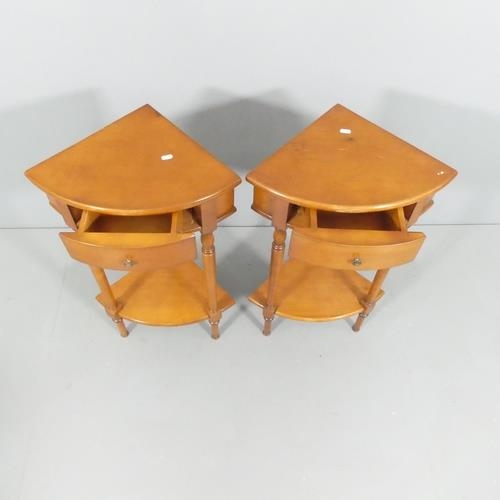 2686 - A modern pair of yew wood two-tier corner tables, each with single drawer and raised on turned suppo... 