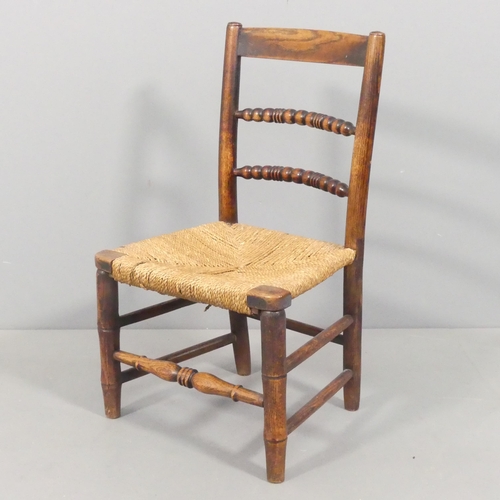 2688 - WITHDRAWN - An antique elm child's chair. Overall 38.5x66x33cm. A/F.