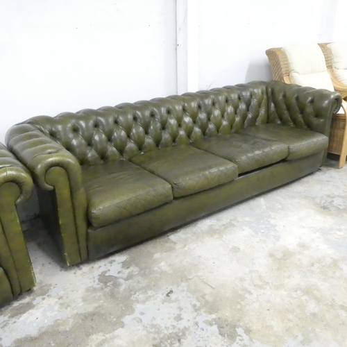 2501 - A four-seater green leather upholstered Chesterfield style sofa. Overall 250x70x90, seat 200x39x60cm... 