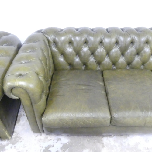 2501 - A four-seater green leather upholstered Chesterfield style sofa. Overall 250x70x90, seat 200x39x60cm... 