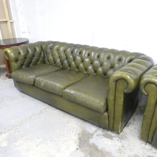 2502 - A three-seater green button-back leather upholstered Chesterfield style sofa. Overall 200x70x90, sea... 