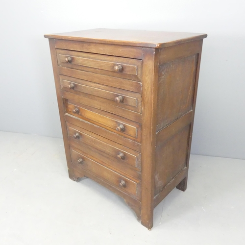 2528 - An early 20th century oak chest of five long drawers, retailed by Bobby & Co of Folkstone (label to ... 