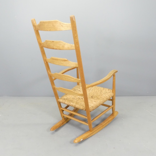 2531 - A Cotswold School style ladder-back rocking chair