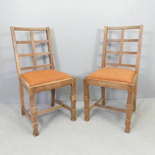 2539 - A pair of oak lattice back Cotswold School side chairs in the manner of Heals.