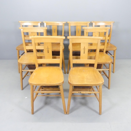 2543 - A set of eight elm seated chapel chairs, with folding leather upholstered kneeling cushions.