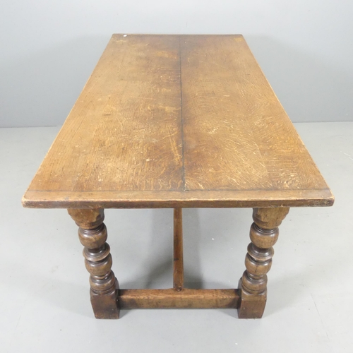 2544 - An antique oak plank-top dining table, raised on turned legs with H-shaped stretcher. 152x77x76cm.