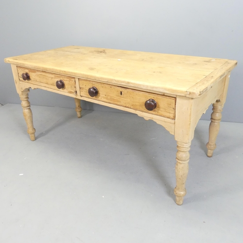 2561 - An antique pine farmhouse dining table, with two drawers and raised on turned legs. 152x72x71cm.