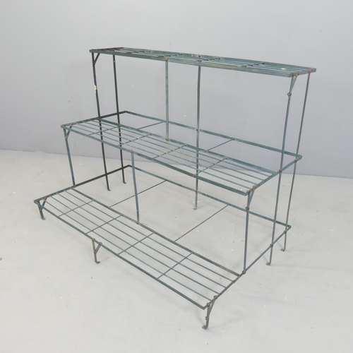 2584 - A painted metal three-tier plant stand. 101x75x61cm