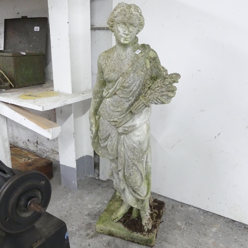 2587 - A weathered concrete garden statue, of a woman holding a wheat sheaf. Height 92cm.