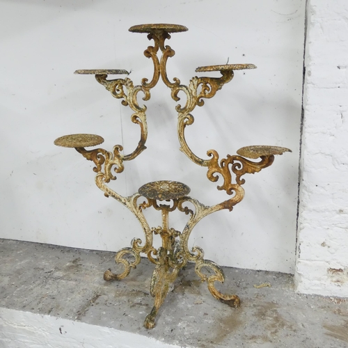 2589 - An antique ornate continental painted metal plant stand. 92x103x46cm.