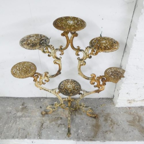 2589 - An antique ornate continental painted metal plant stand. 92x103x46cm.