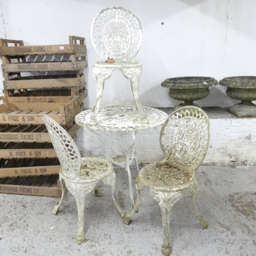 2595 - A painted aluminium garden table, 76x71cm, and three matching chairs.